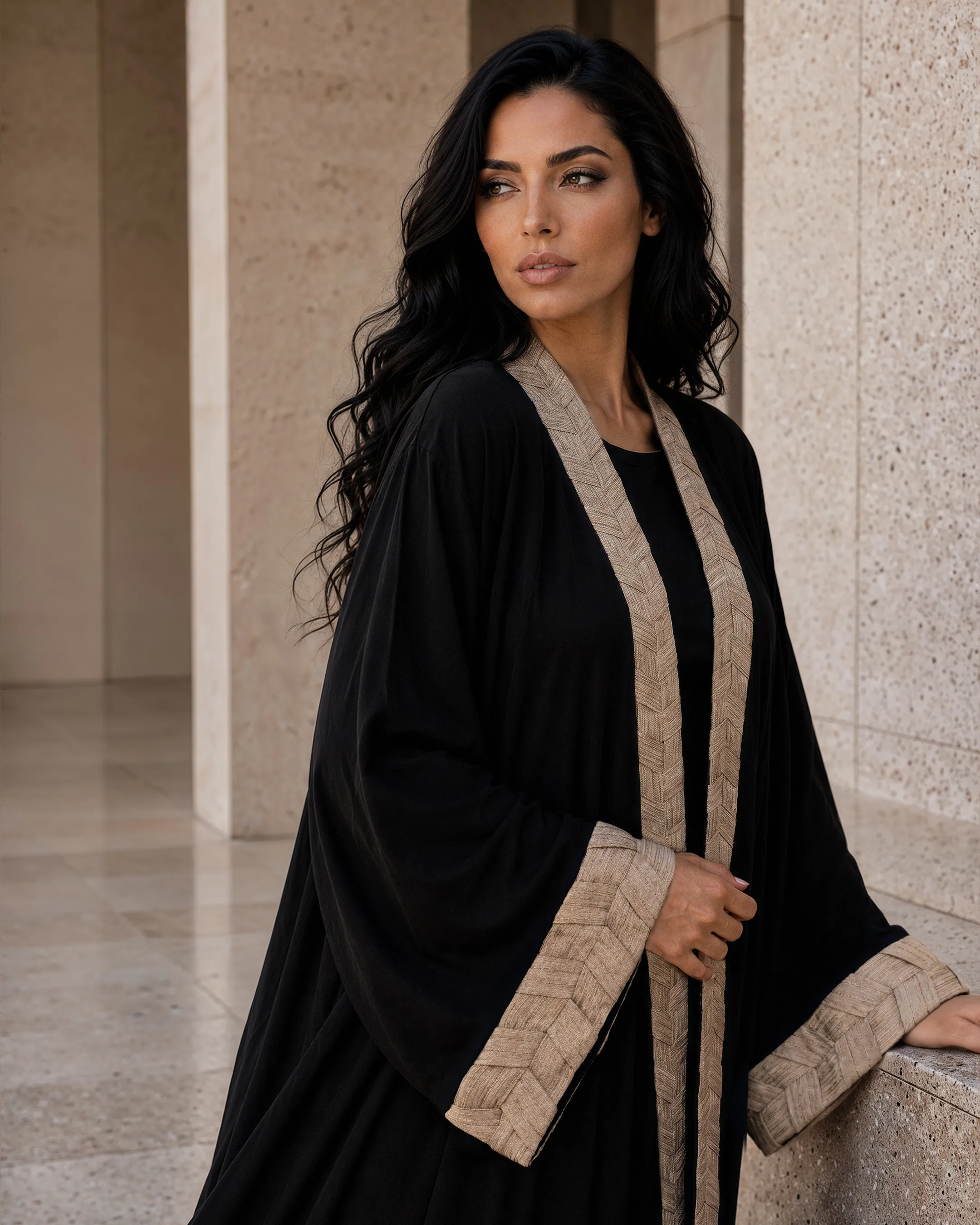 Belgravia Abaya luxury abaya in Black, detail view, detail of trim inspired by traditional Khous weaving, Emirati heritage and Abu Dhabi culture. Bint Saeed Abu Dhabi, UAE.