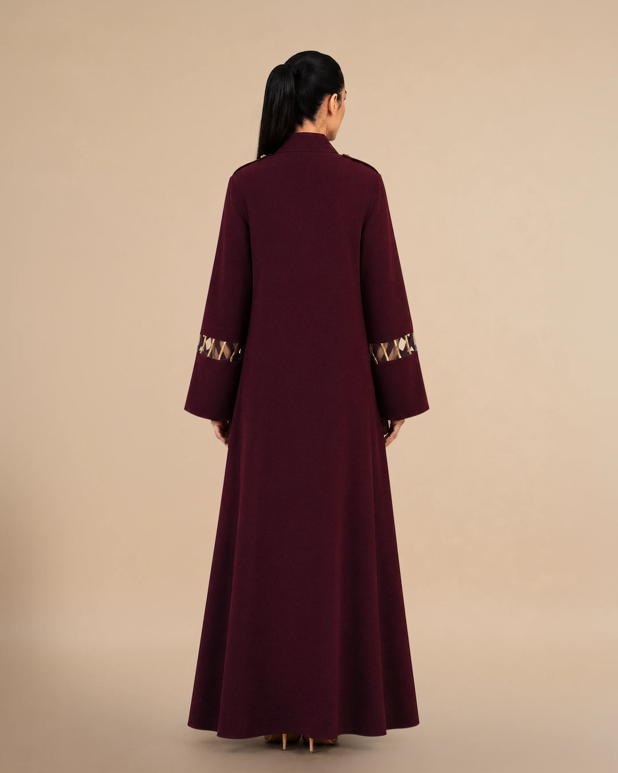 Covent Garden Abaya luxury abaya in Burgundy, back view, traditional Al Talli trim celebrating Emirati heritage and Abu Dhabi culture. Bint Saeed Abu Dhabi, UAE.