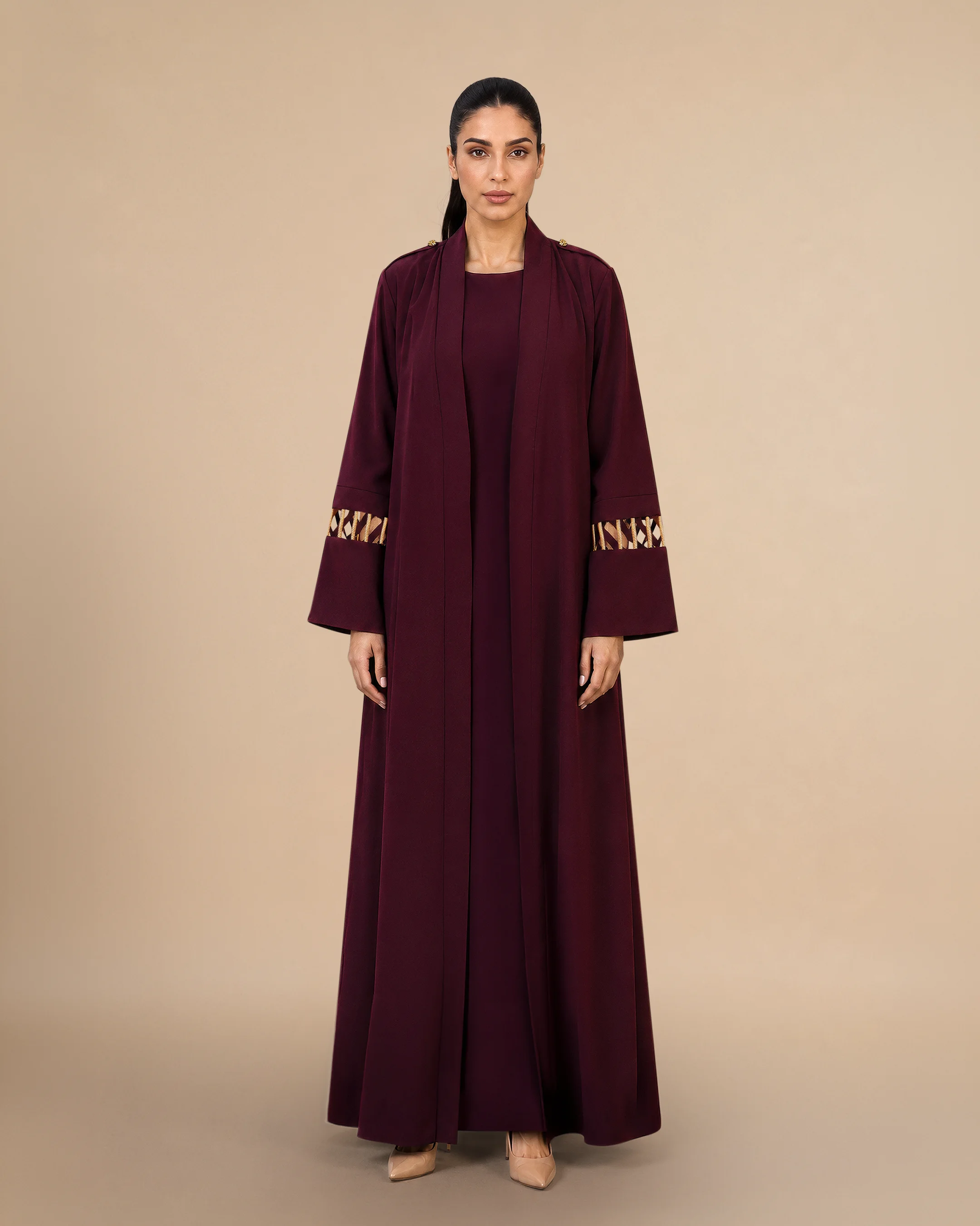 Covent Garden Abaya luxury abaya in Burgundy, front view, traditional Al Talli trim celebrating Emirati heritage and Abu Dhabi culture. Bint Saeed Abu Dhabi, UAE.