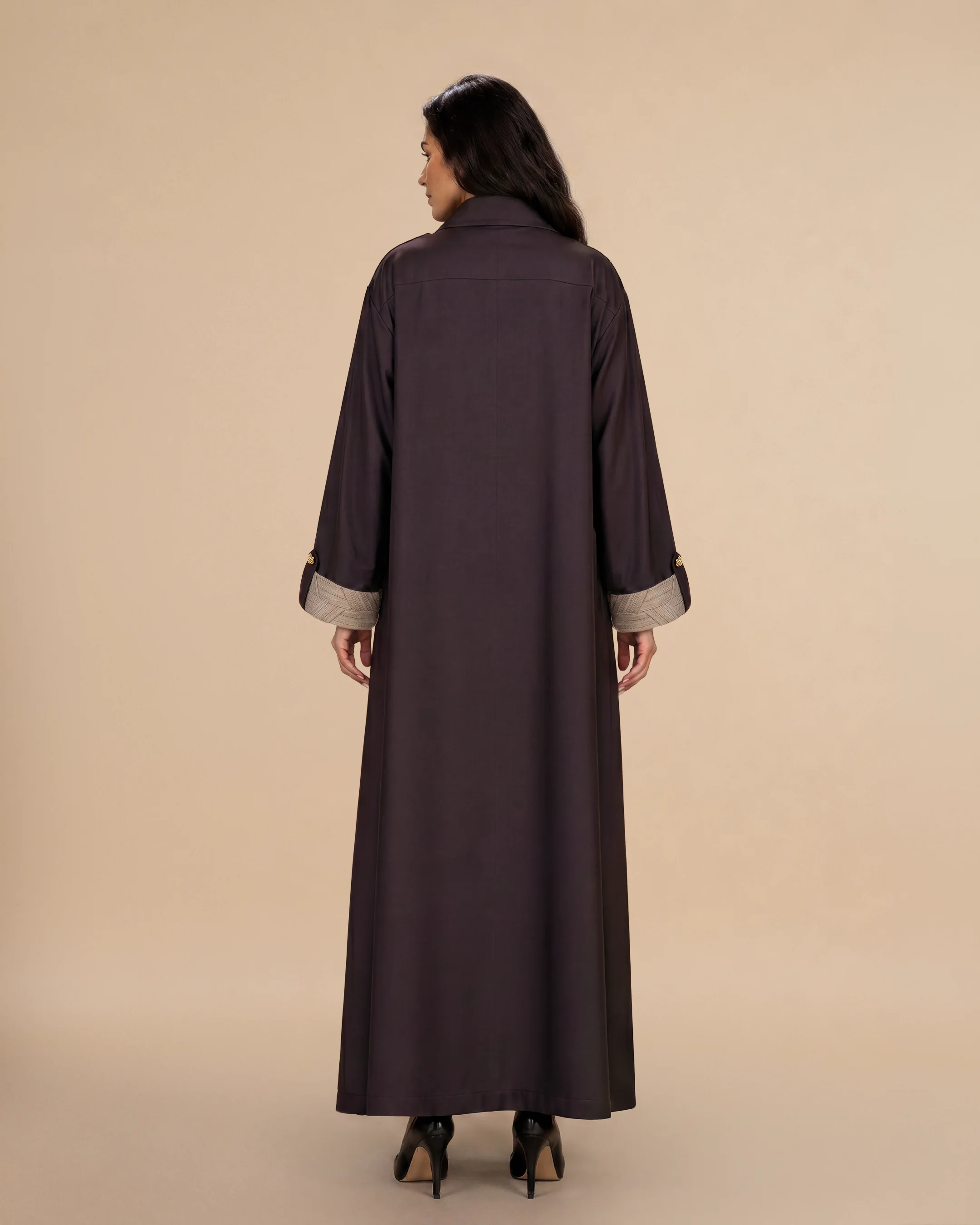 Knightsbridge Abaya Jacket luxury abaya in Dark Brown, back view, trim inspired by traditional Khous weaving, Emirati heritage and Abu Dhabi culture. Bint Saeed Abu Dhabi, UAE.