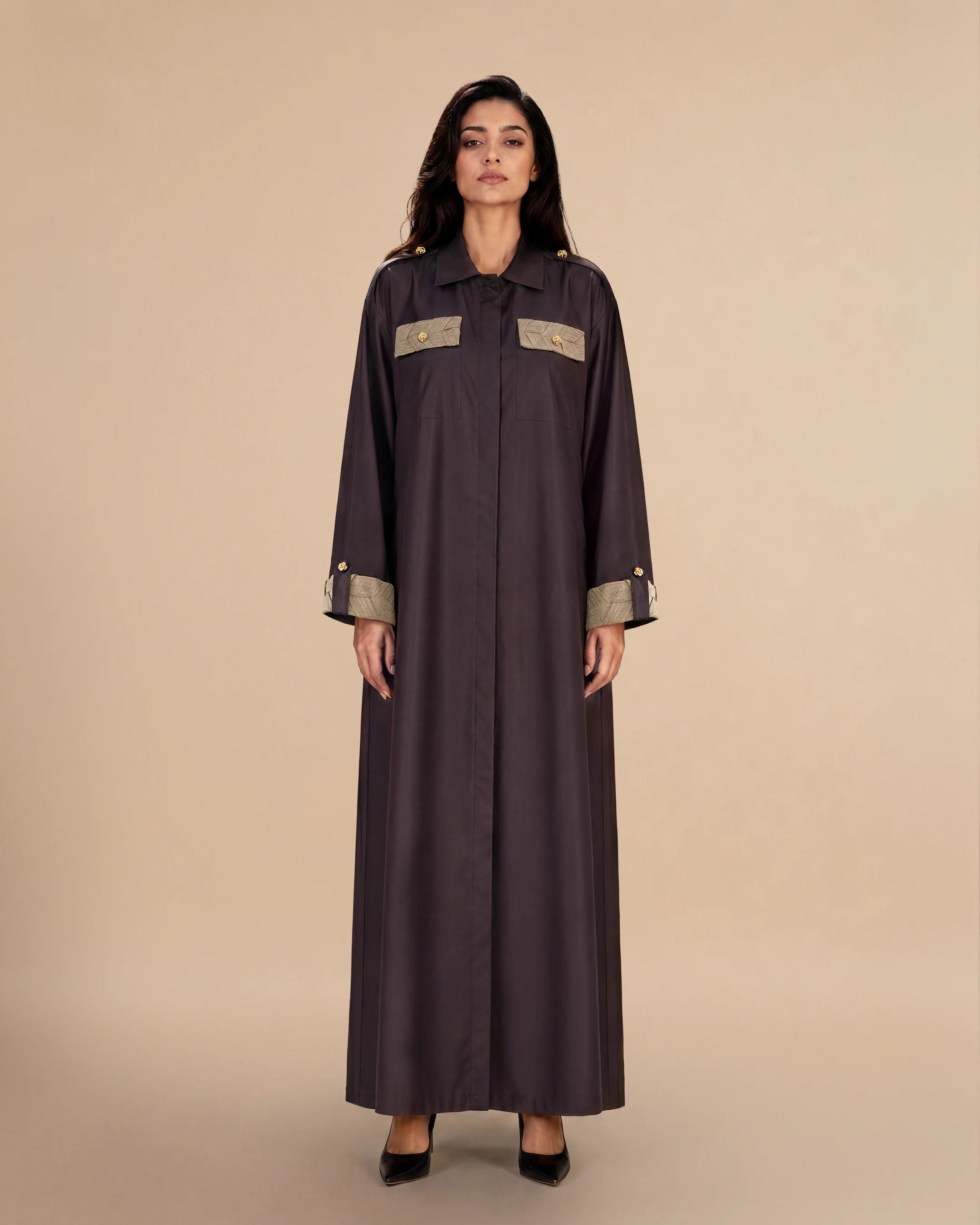 Knightsbridge Abaya Jacket luxury abaya in Dark Brown, front view, trim inspired by traditional Khous weaving, Emirati heritage and Abu Dhabi culture. Bint Saeed Abu Dhabi, UAE.