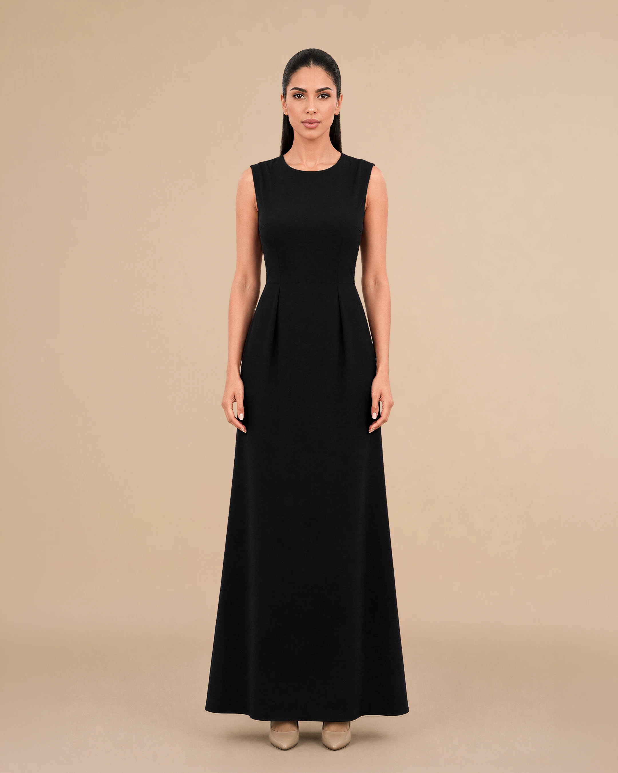 Covent Garden Long Dress in Deep Black, tampak depan — a formal, classy, elegant and simple terstruktur gaun maxi colour variant oleh Bint Saeed, an Emirati contemporary brand from Abu Dhabi, Uni Emirat Arab. Timeless black long dress with a fitted maxi silhouette and clean round neckline. Bint Saeed Abu Dhabi, Uni Emirat Arab.