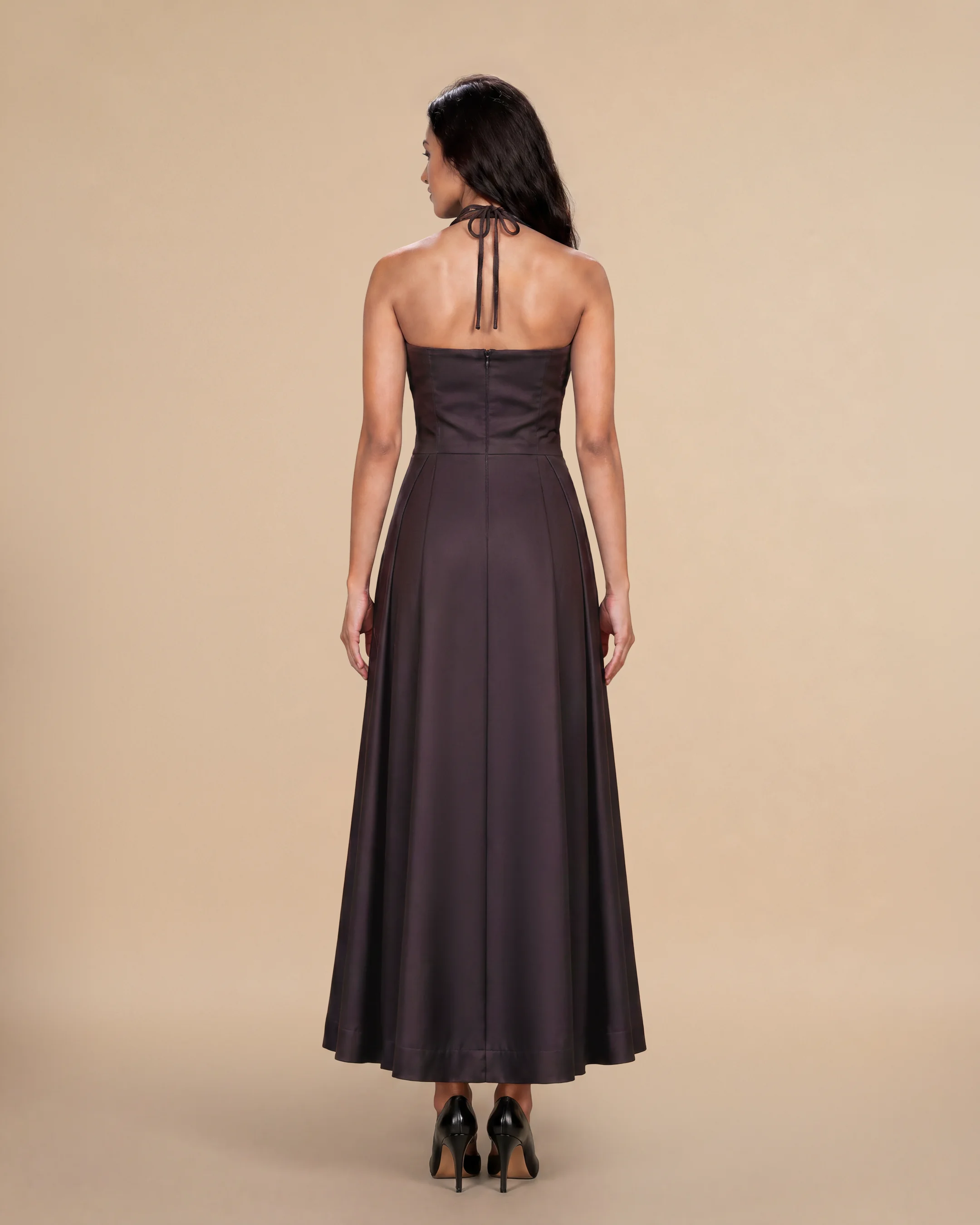 Knightsbridge Dress luxury dress in Dark Brown, back view, trim inspired by traditional Khous weaving, Emirati heritage and Abu Dhabi culture. Bint Saeed Abu Dhabi, UAE.