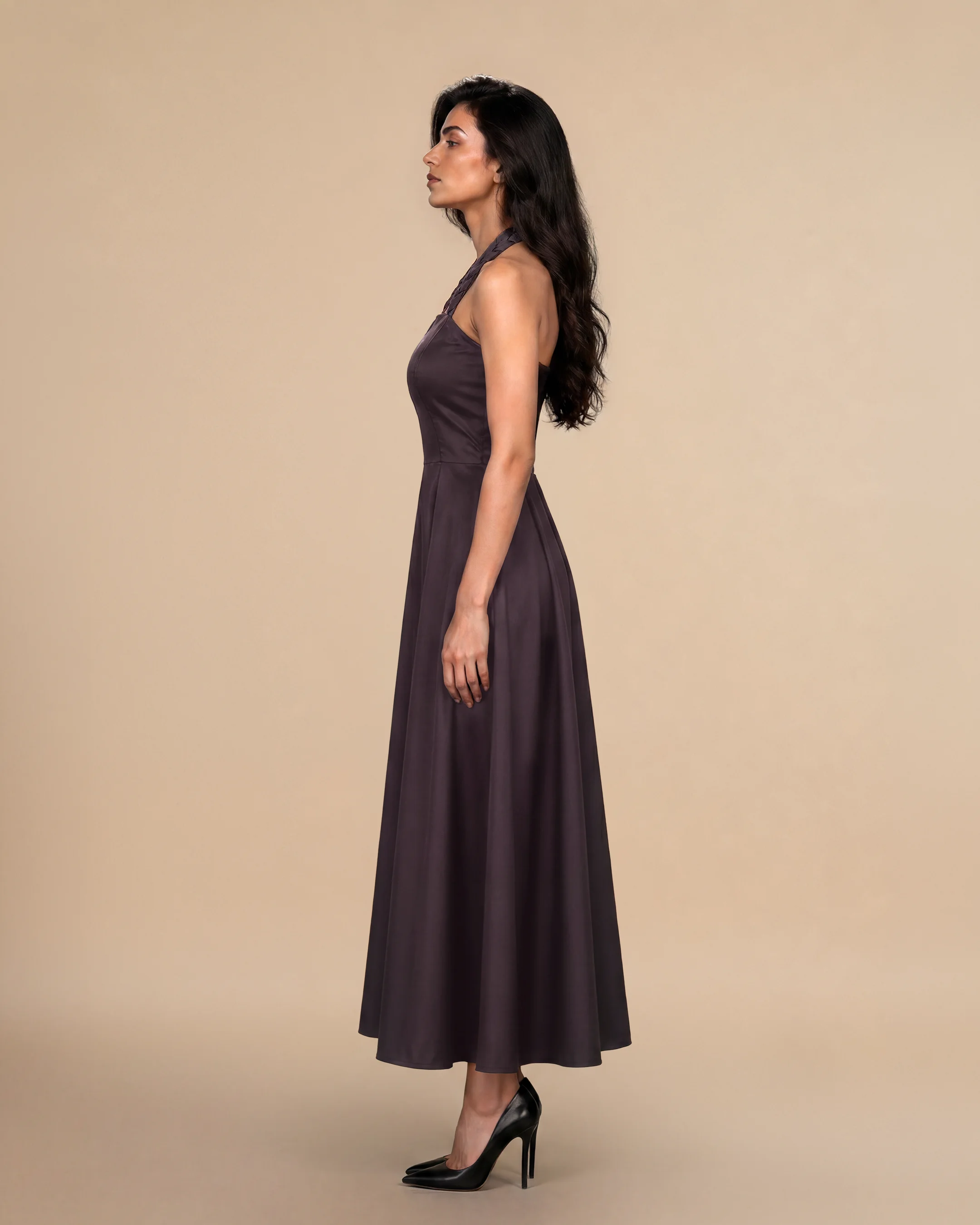 Knightsbridge Dress luxury dress in Dark Brown, side view, trim inspired by traditional Khous weaving, Emirati heritage and Abu Dhabi culture. Bint Saeed Abu Dhabi, UAE.