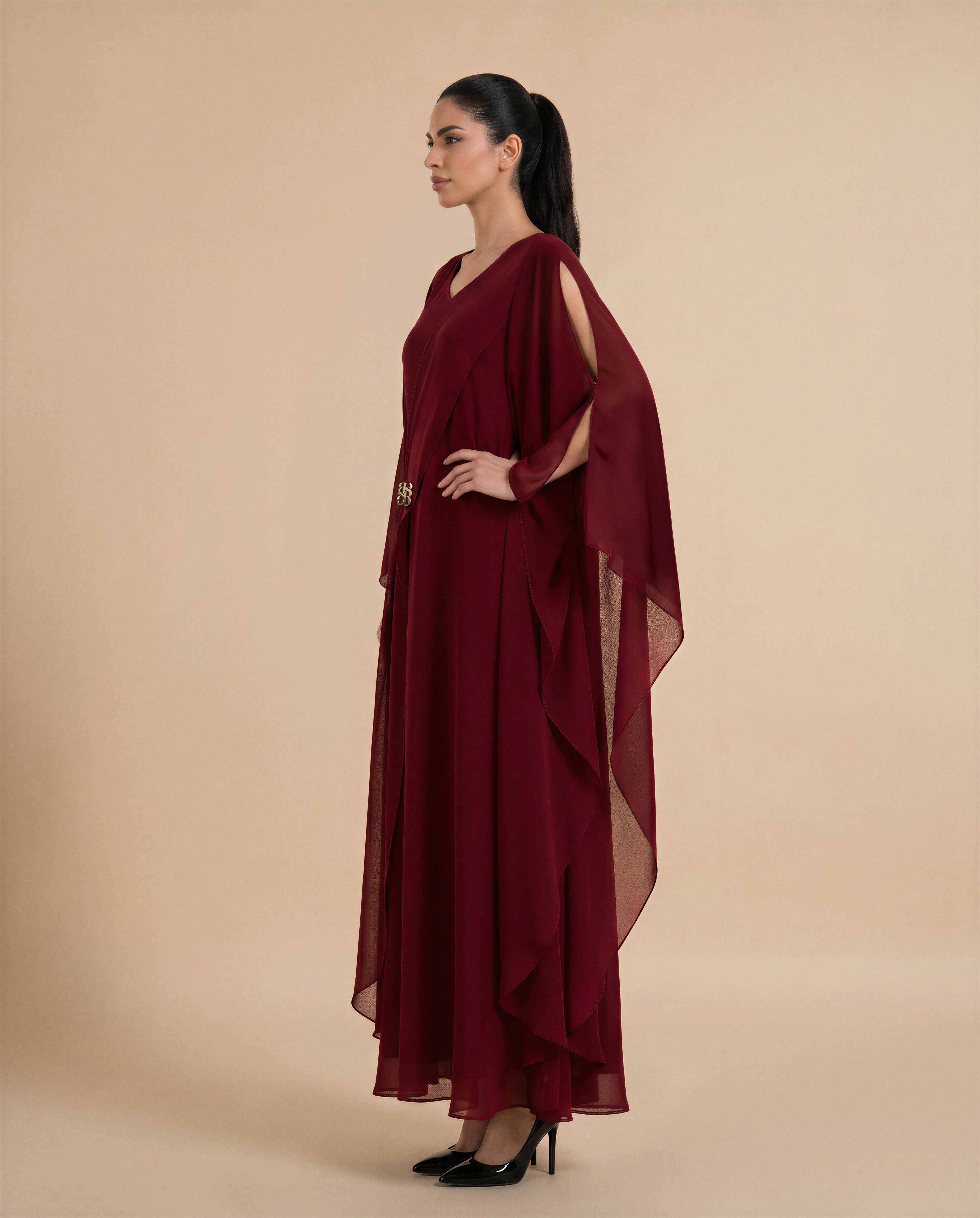 Mayfair Kaftan luxury kaftan in Dark Maroon, side view. Bint Saeed Abu Dhabi, UAE.