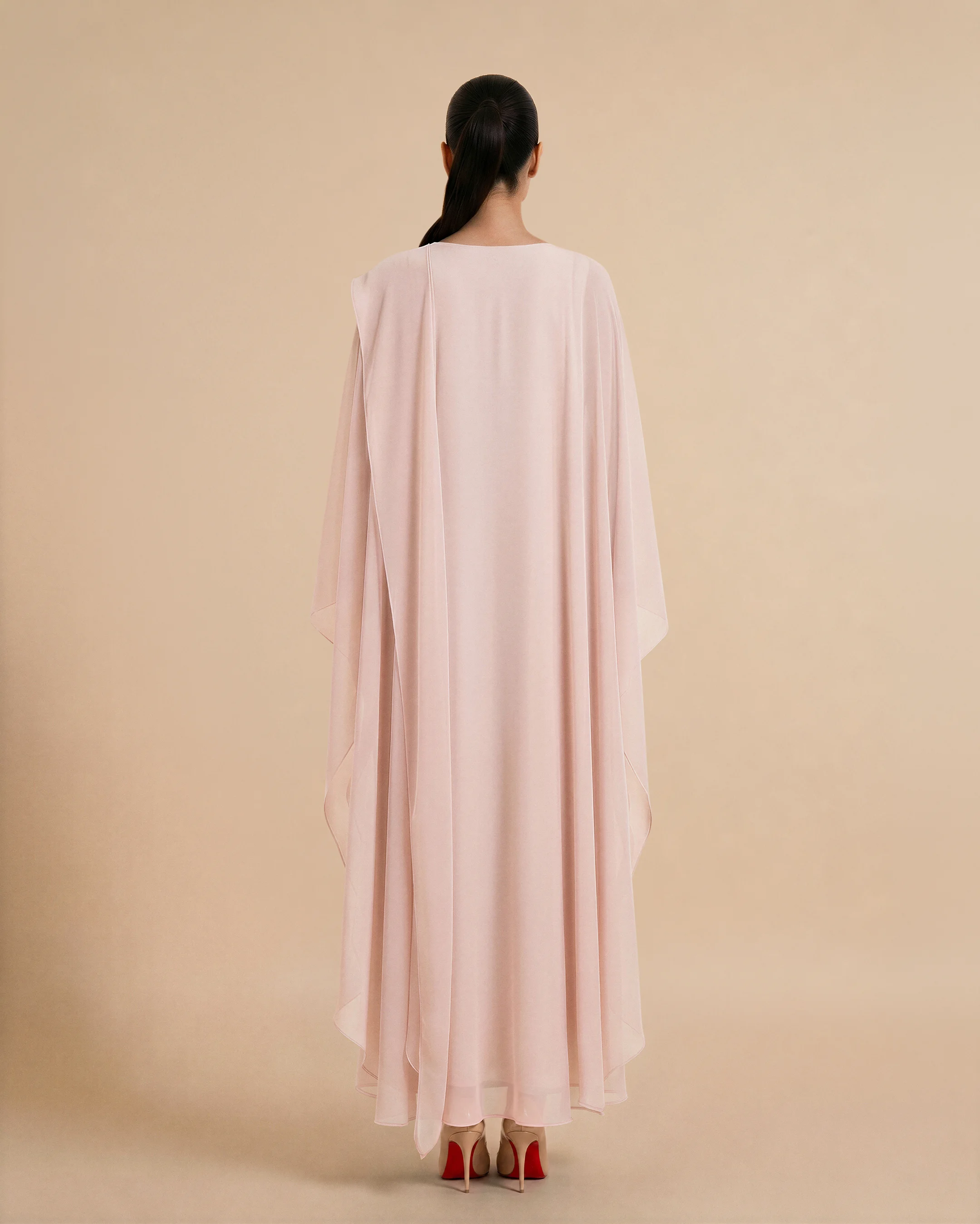 Nothing Hill Kaftan luxury kaftan in Peach Pink, back view. Bint Saeed Abu Dhabi, UAE.