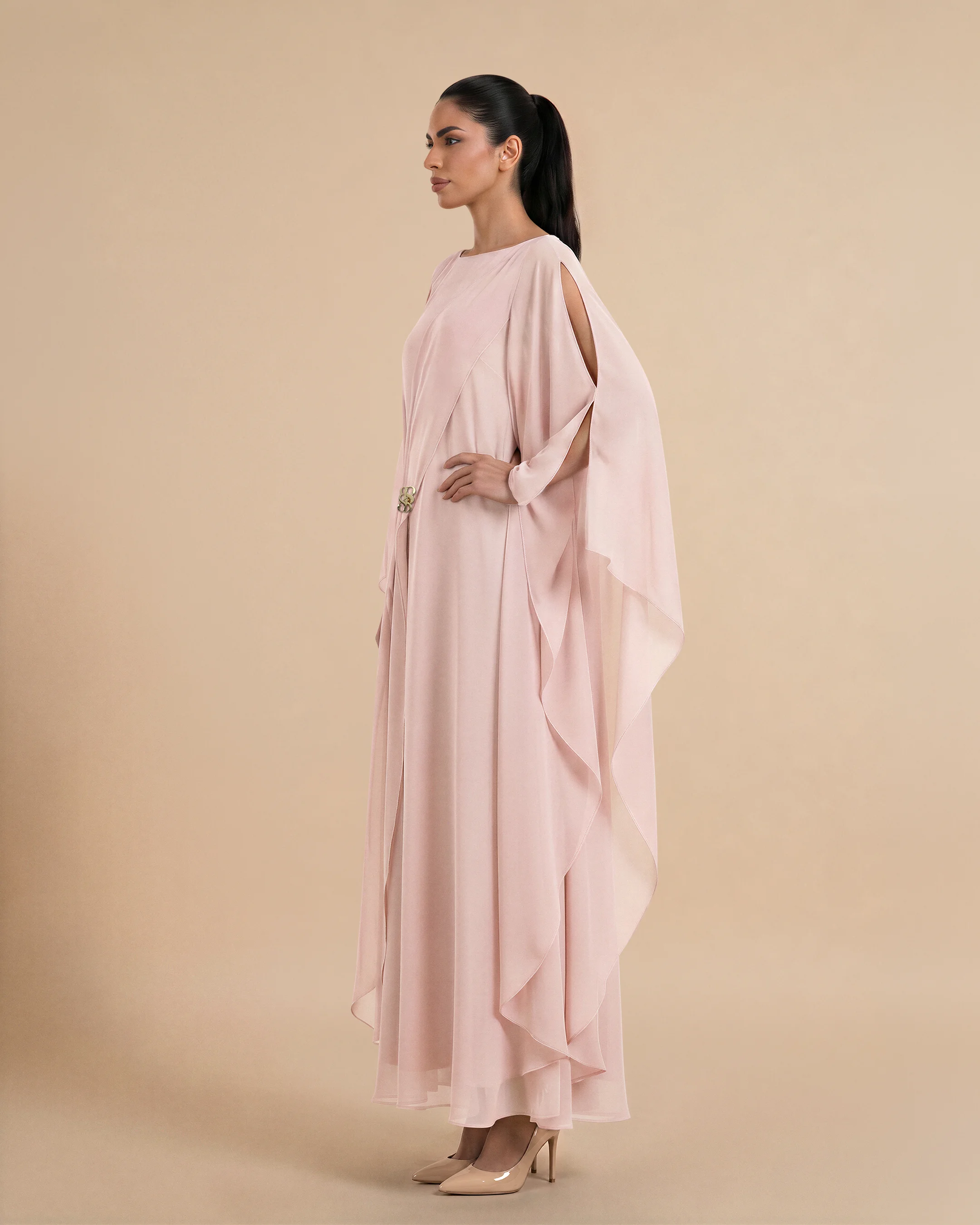 Nothing Hill Kaftan luxury kaftan in Peach Pink, side view. Bint Saeed Abu Dhabi, UAE.