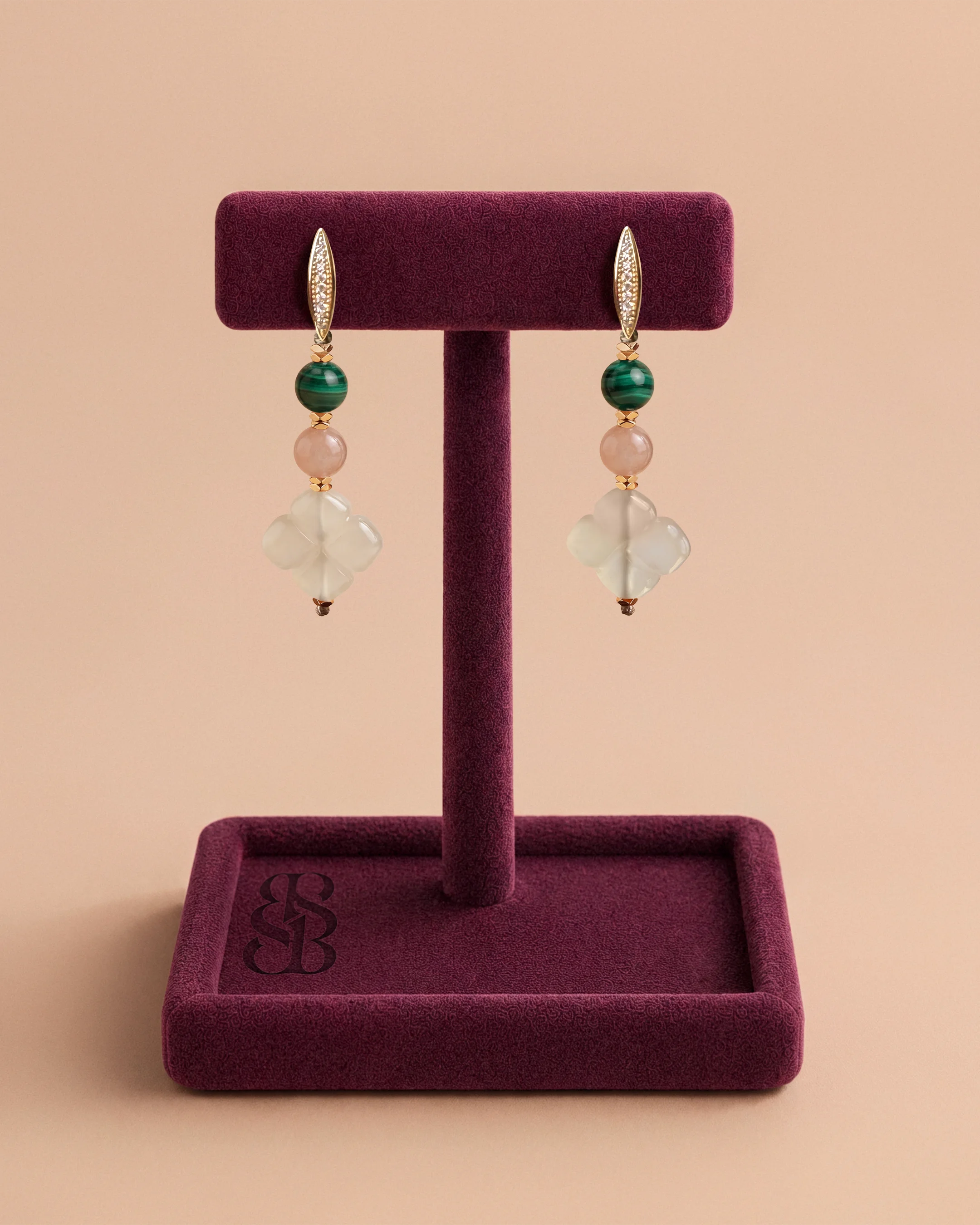 Al Ain Oasis Earrings - Malachite by Bint Saeed: genuine Malachite and Sunstone gemstones, hand-carved Carnelian Al Ain Rosette, faceted gold-plated Hematite and pavé zirconia leverback clasp in 14k gold-plated nickel-free copper. Luxury hand-assembled drop earrings, drop 5.5 cm. Made in Abu Dhabi, United Arab Emirates. Worldwide shipping. Bint Saeed Abu Dhabi, United Arab Emirates.