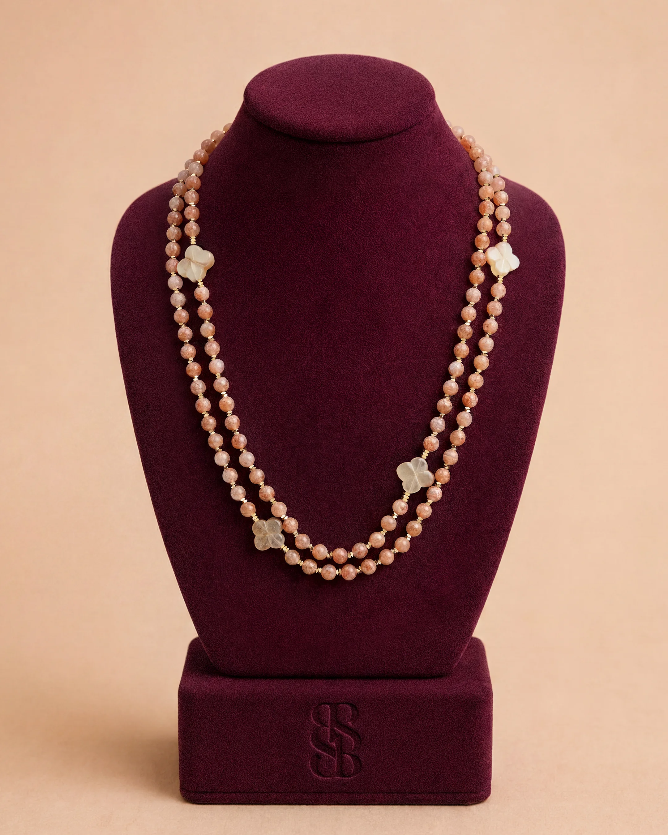 Al Ain Oasis Necklace - Sunstone by Bint Saeed: luminous natural sunstone beads, Carnelian Al Ain Rosette and 18K gold-plated signature clasp — handcrafted stone bead necklace in Abu Dhabi, United Arab Emirates. Worldwide shipping. Bint Saeed Abu Dhabi, United Arab Emirates.