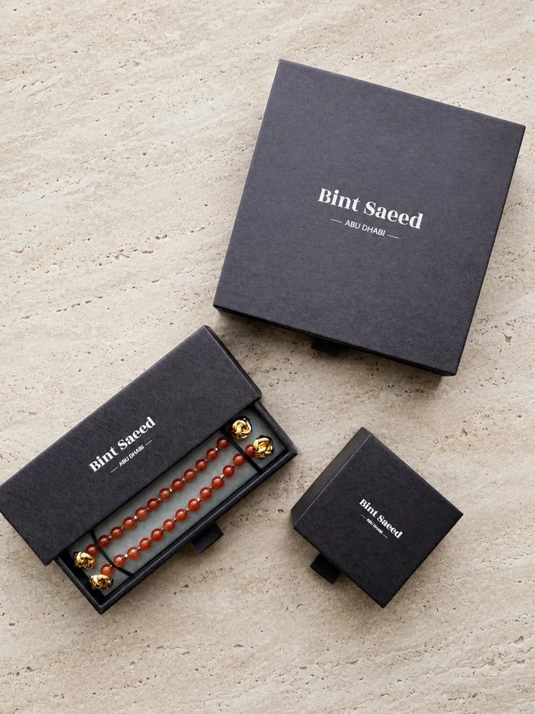 Bint Saeed Abu Dhabi signature jewellery packaging — matte black gift boxes with drawer presentation. Bint Saeed Abu Dhabi, United Arab Emirates.