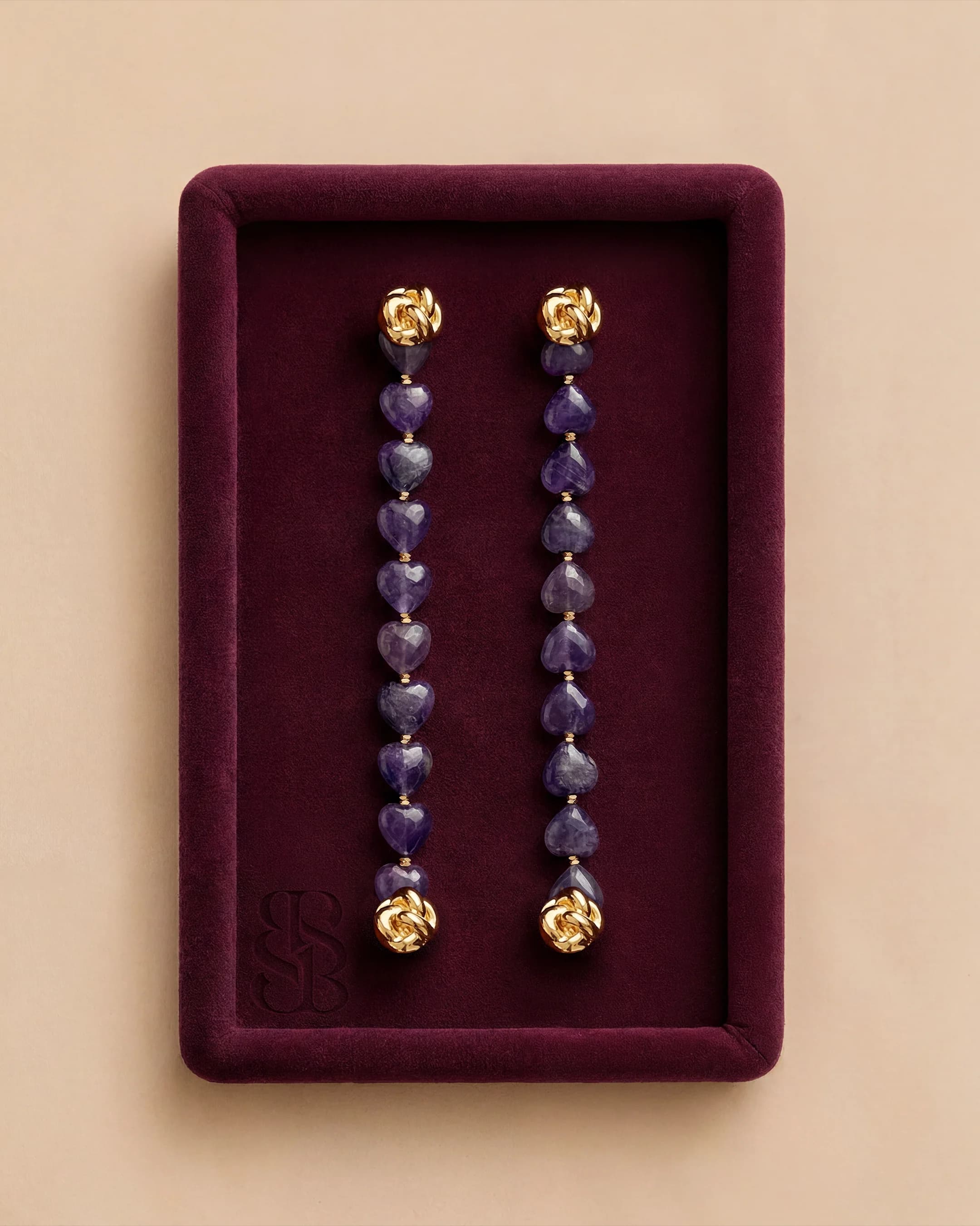 Amethyst hearts natural stone bead abaya strand — limited edition violet heart-cut beads pair with Al Ain Oasis Necklace - Lapis Lazuli and Al Quaa Earrings - Lapis Lazuli. Bint Saeed Abu Dhabi, United Arab Emirates.