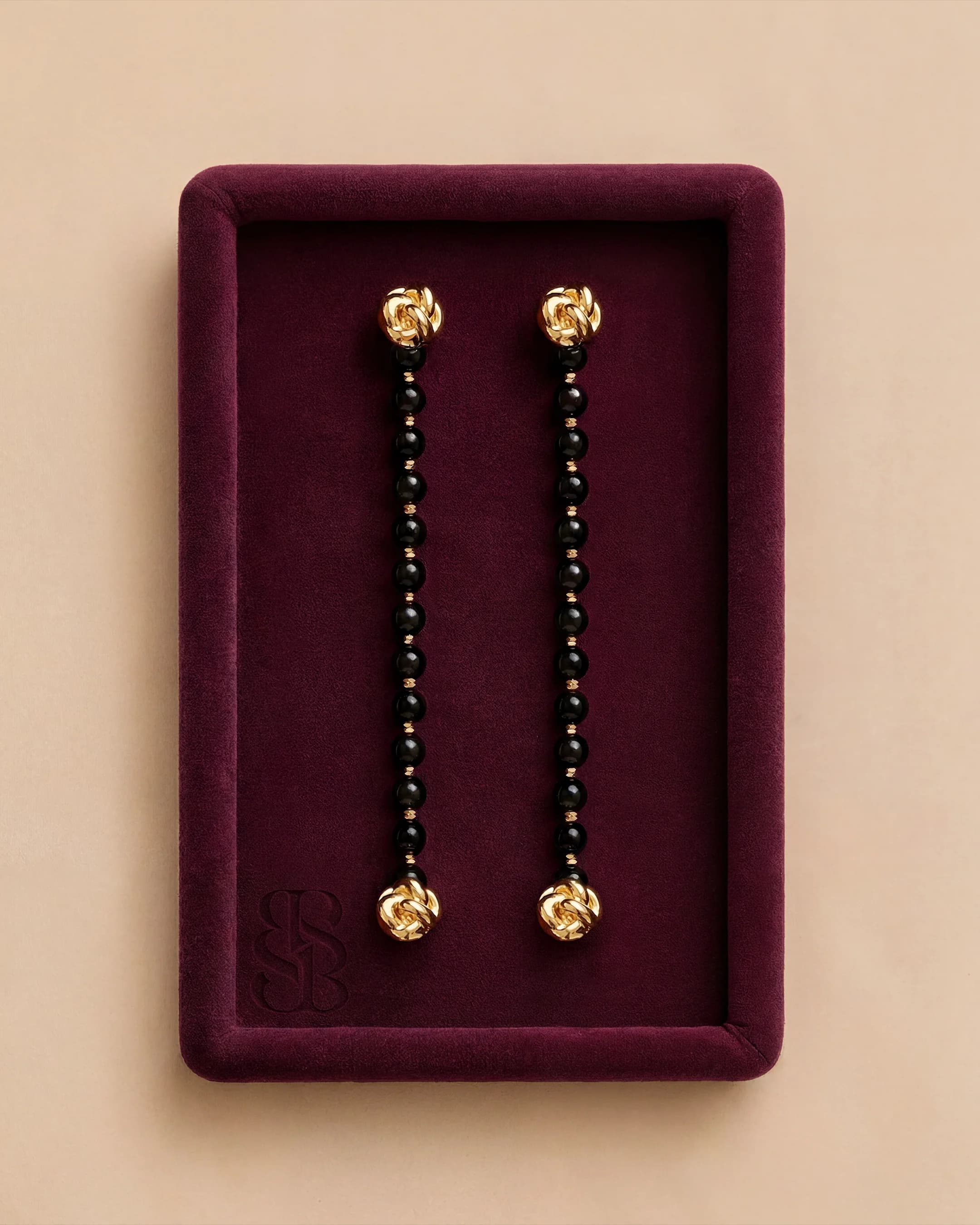 Black onyx natural stone bead abaya strand with 18K gold clip — pairs with Al Ain Oasis Necklace - Onyx and Al Ain Oasis Earrings - Orange Jade for Marylebone Abaya. Bint Saeed Abu Dhabi, United Arab Emirates.