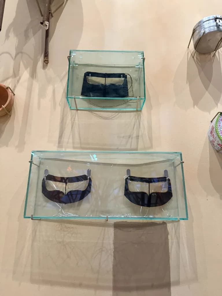 Emirati battoulah face masks in museum display, traditional Gulf gold burqa mask heritage, United Arab Emirates. Bint Saeed Abu Dhabi, United Arab Emirates.
