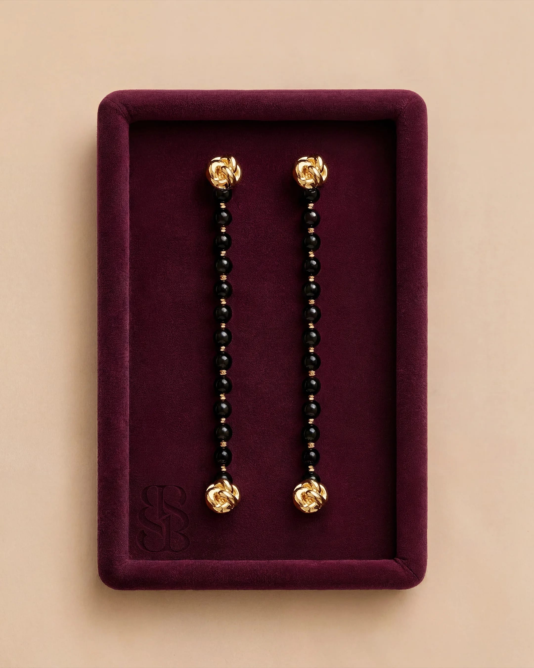 Onyx natural stone bead abaya strand, hand-strung black onyx beads with 18K gold-plated clip — interchange for Bint Saeed Marylebone Abaya, pairs with Al Ain Oasis Necklace - Onyx. Bint Saeed Abu Dhabi, United Arab Emirates.