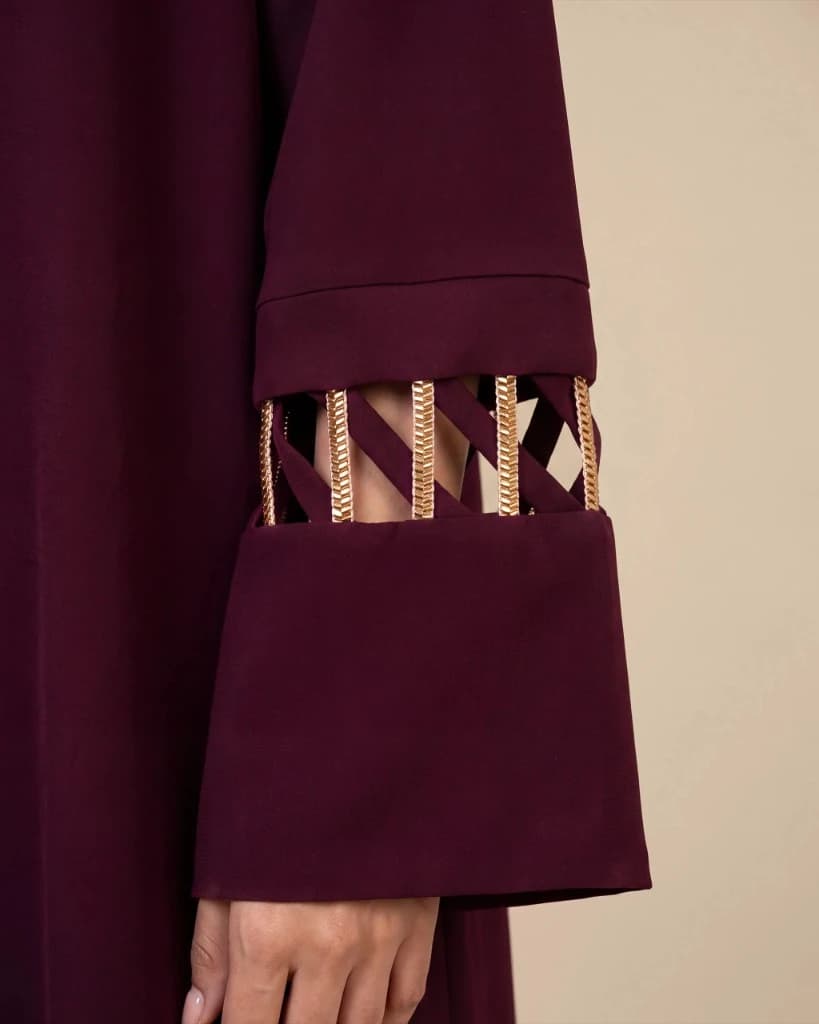 Covent Garden Abaya burgundy sleeve with traditional Al Talli woven cuff trim, Bint Saeed Abu Dhabi