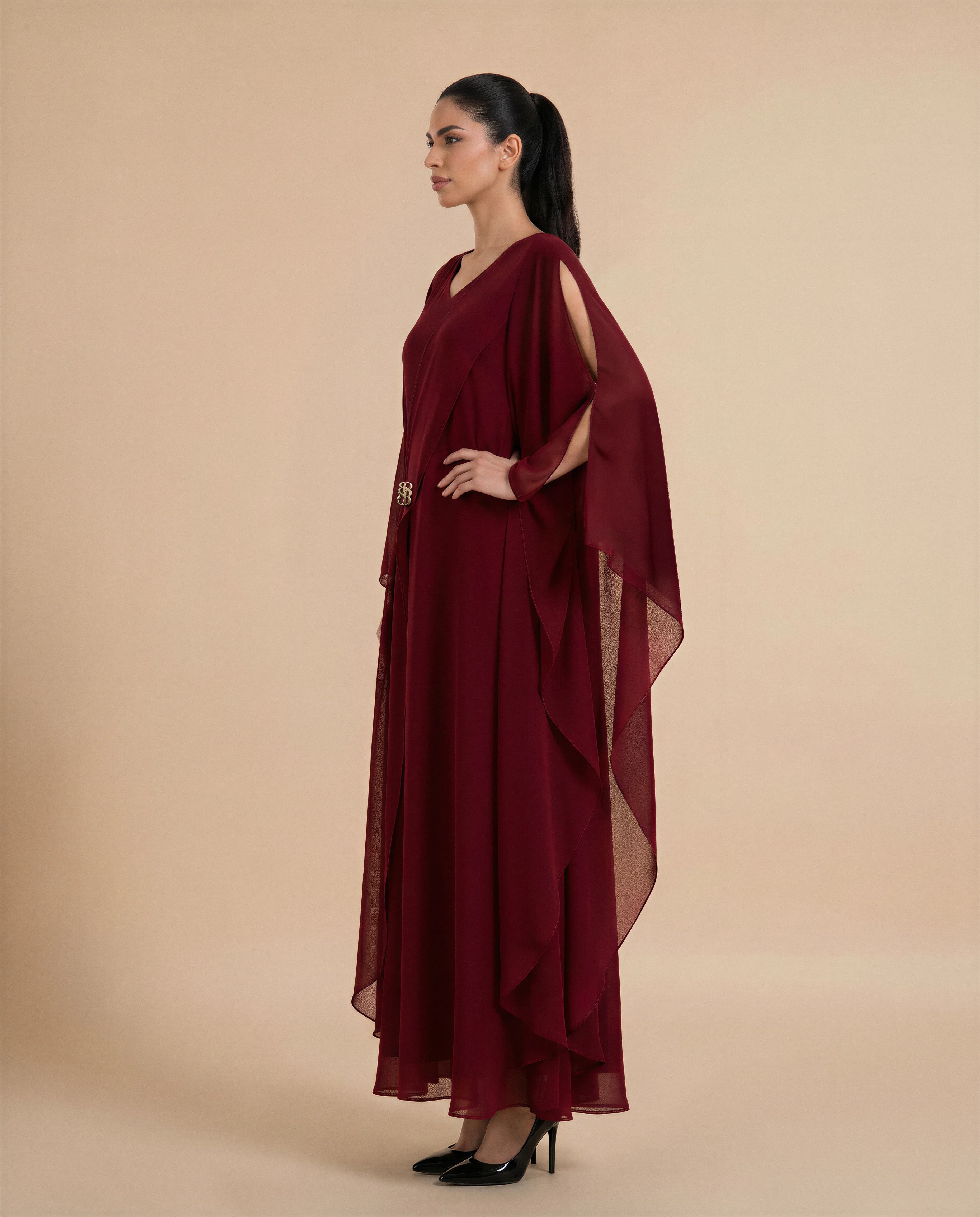 Mayfair Kaftan luxury kaftan in Dark Maroon, side view. Bint Saeed Abu Dhabi, UAE.
