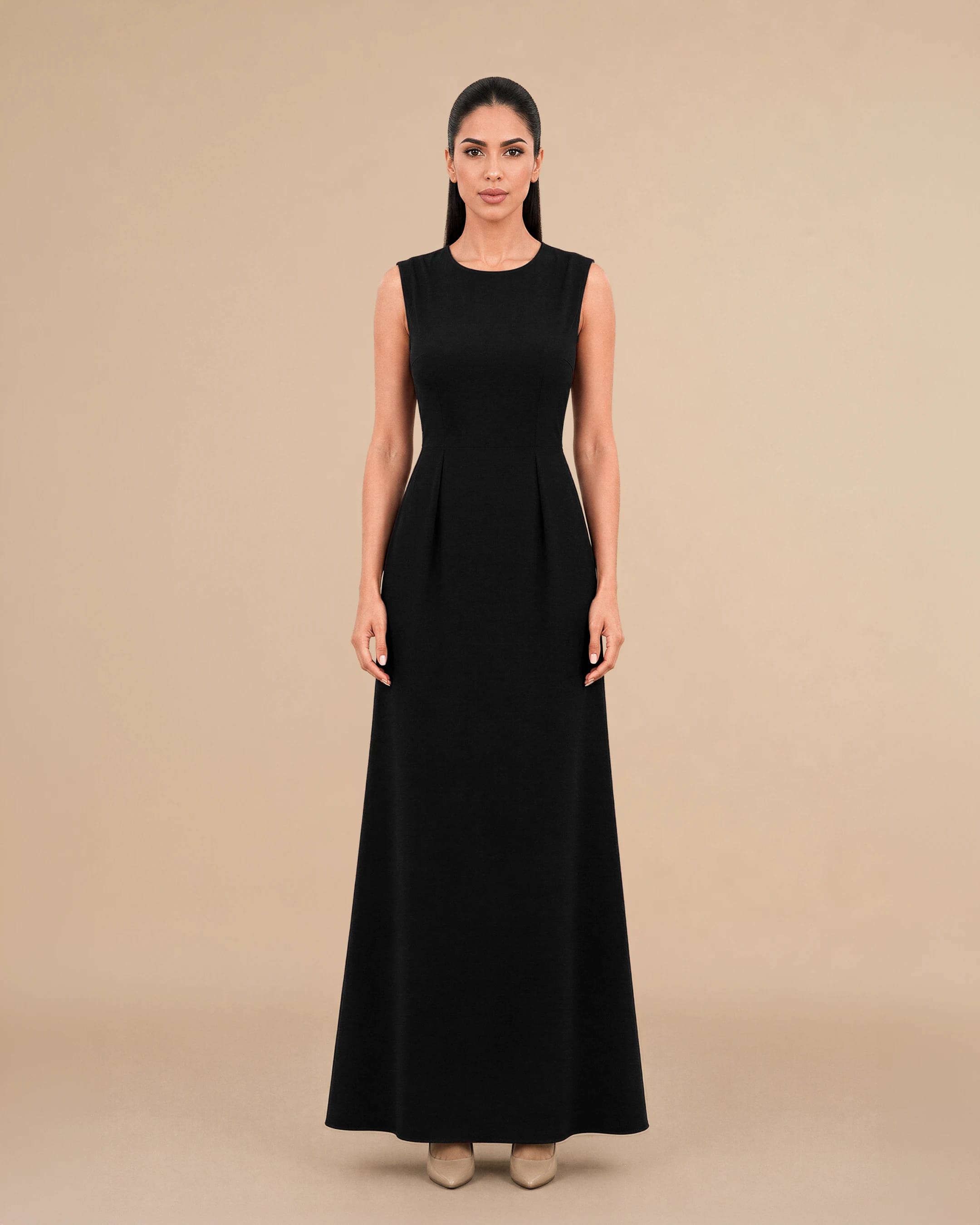 Covent Garden Long Dress in Deep Black, tampak depan — a formal, classy, elegant and simple terstruktur gaun maxi colour variant oleh Bint Saeed, an Emirati contemporary brand from Abu Dhabi, Uni Emirat Arab. Timeless black long dress with a fitted maxi silhouette and clean round neckline. Bint Saeed Abu Dhabi, Uni Emirat Arab.