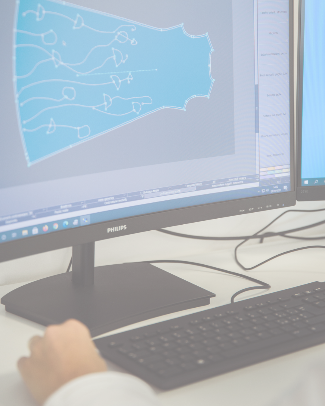 Bint Saeed CAD abaya pattern on screen—technical lines for proportion and construction resolved before cutting; luxury development between Italy and Abu Dhabi