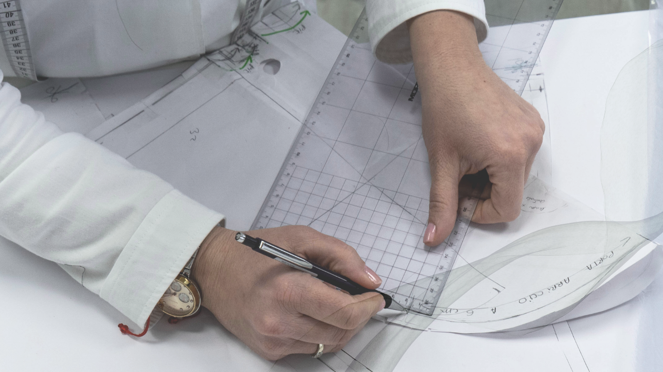 Bint Saeed—abaya pattern drawing during development; proportion, balance, and construction studied before sampling and production